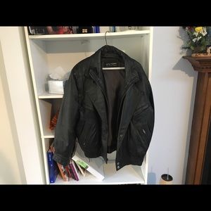 Heavy Leather coat with multiple pockets.